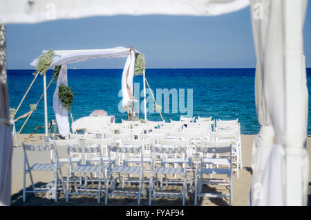 Wedding ceremony set up on the beach in Italy Stock Photo