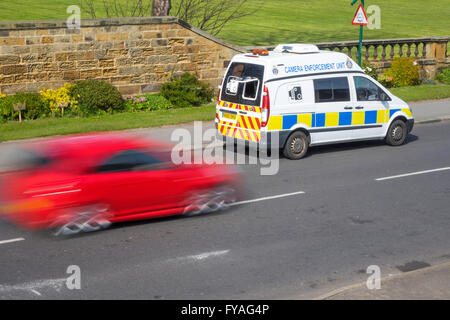 Police van Camera Enforcement Unit covert measuring of motor vehicle speed to check speed limit compliance red car speeding by Stock Photo