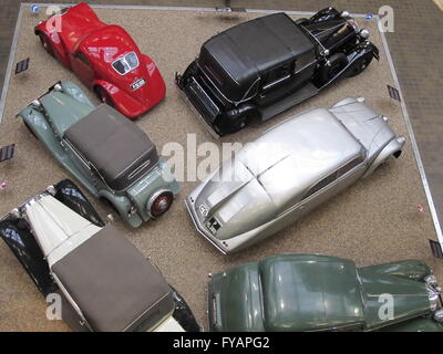 Prague, Czech Republic. Vintage JAWA vehicle (red) with other pre war automobiles including 1936 Tatra 87 (silver) at the Nation Stock Photo