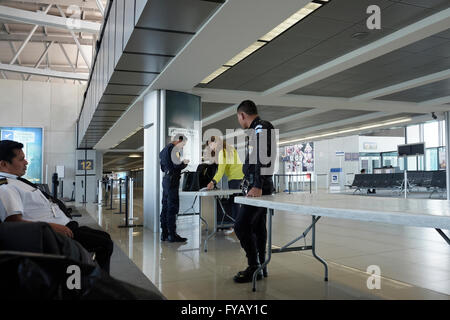 Passenger being checked up in security checkpoint before entering flight departure gate at La Aurora International Airport in Guatemala city in Guatemala central America Stock Photo