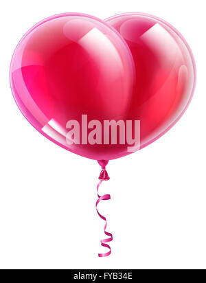 A  pink or red heart shaped valentines day balloon Stock Photo