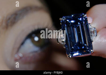 London, UK. 25th April, 2016. A Christie's employee views the Oppenheimer Blue, 14.62 carat diamond that has an estimated value of upto US$45 million, during a photo-call at Christie's Auction House in London, UK, Monday April 25, 2016.  The piece is part of the 'Magnificent Jewels' sale at Christie's Auction House in Geneva May 18, 2016. Credit:  Luke MacGregor/Alamy Live News Stock Photo