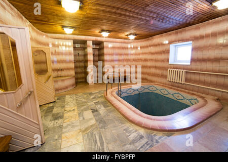 Swimming pool indoor with sauna Stock Photo