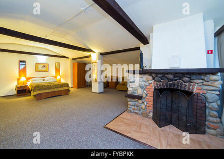 Hotel apartments interior with fireplace Stock Photo