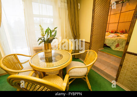 Hotel apartments interior with rattan furniture in oriental style Stock Photo