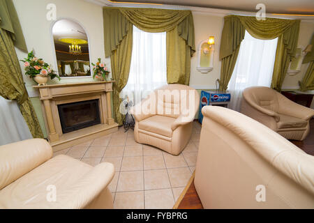 Hotel apartments interior with fireplace Stock Photo