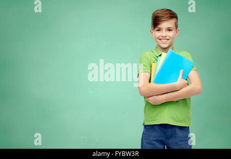 happy student boy with folders and notebooks Stock Photo