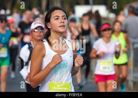 Committed Female Athlete Running In The Nike Woman's Half Marathon, San Francisco, California, USA, 2015. Stock Photo