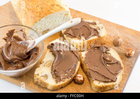 Chocolate cream on a homemade walnut bread slices Stock Photo