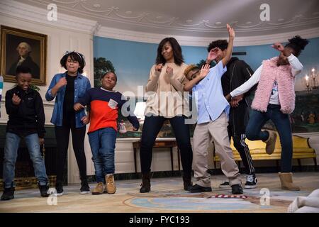 U.S First Lady Michelle Obama dances with students as she participates in a 'Let's Move!' taping for the Late Show with Stephen Colbert in the Diplomatic Room of the White House January 28, 2016 in Washington, D.C. Stock Photo