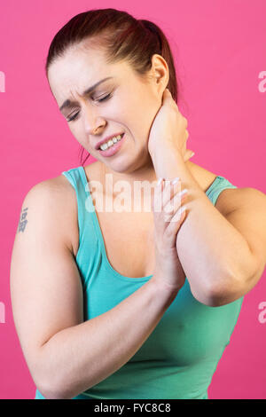 Woman hands on neck in pain Stock Photo