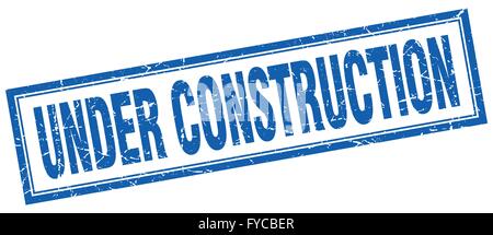 under construction blue square grunge stamp on white Stock Vector