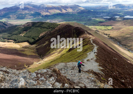 Walkers on the Path up Grisedale Pike and the View Towards Skiddaw, Lake District Cumbria UK Stock Photo