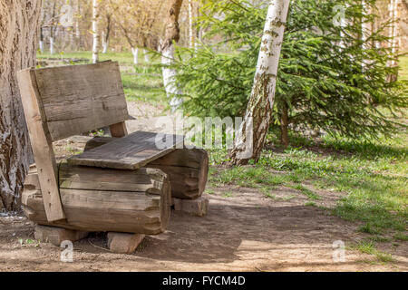 old wooden bench in forest. Stock Photo