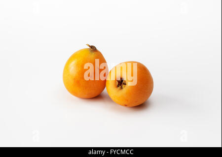 Two Medlar Fruits, Spanish Nisperos Stock Photo