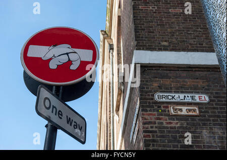 Sumo wrestler on a one way street sign in Brick Lane, East London designed by Clet Abraham Stock Photo