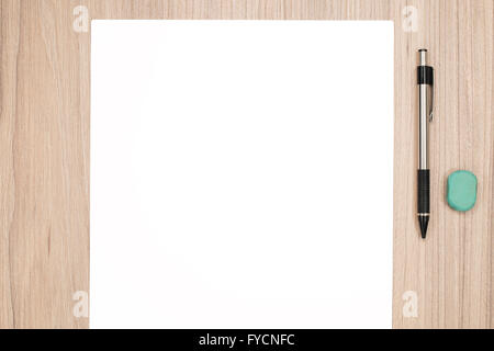 Blank paper with pencil and rubber on wood desk Stock Photo