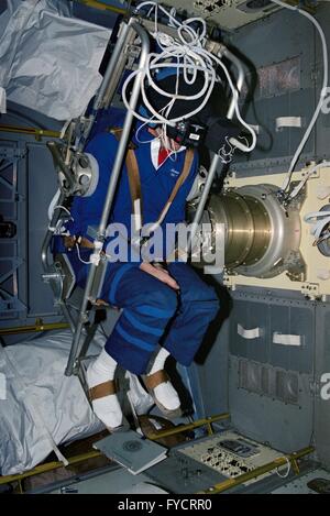 NASA astronaut David Hilmers sits in the Microgravity Vestibular Investigation rotating chair in the science module aboard the Space Shuttle Discovery mission STS-42 January 23, 1992 in Earth Orbit. Stock Photo