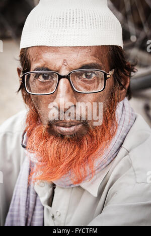 Henna dyed beard displayed in a portrait photograph of an Indian Muslim man Stock Photo