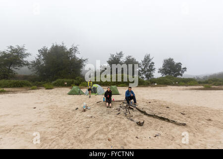 Young adults go hiking and camping in Tai Long Wan, next to Ham Tim Beach in the  New Territories, Hong Kong Stock Photo