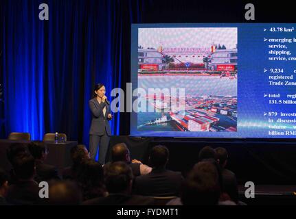 Sydney, Australia. 26th Apr, 2016. A staffer introduces the plans and attractions during a showcase of the China International Fair for Investment and Trade (CIFIT) in Sydney, Australia, April 26, 2016. Australia will take center stage at the CIFIT in southeast China's Xiamen during September 2016. A total of 50 Australian companies and industry groups are expected to participate in the expo. © Hongye Zhu/Xinhua/Alamy Live News Stock Photo