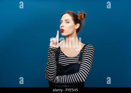 Portrait of a woman in a hat Pose side view of finger gesture red lips  22312332 Stock Photo at Vecteezy