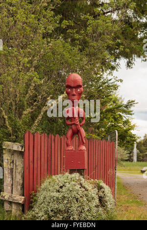 Maori carved wooden pou or gate guardian in Tokaanu New Zealand Stock Photo