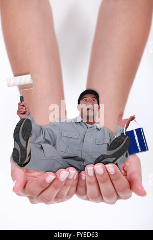 Photomontage of a man falling in hands of a woman Stock Photo