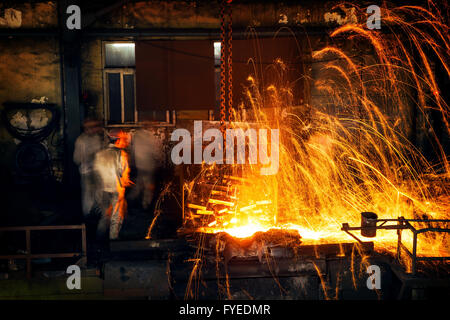 Pouring of liquid metal in open hearth workshop Stock Photo