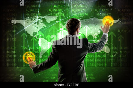 Rear view of businessman touching digital screen Stock Photo