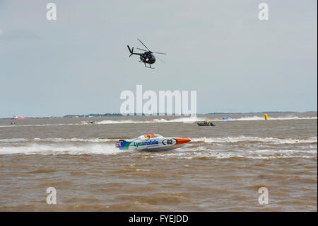P1 Superstock powerboat racing along the Humber past the Marina in the city of Hull being filmed from a helicopter Stock Photo