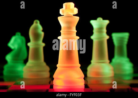 red and green glass chess pieces Stock Photo