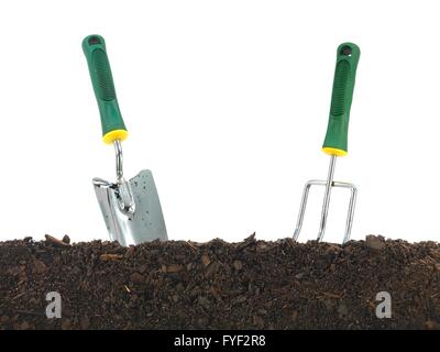 Garden soil and implements isolated against a white background Stock Photo