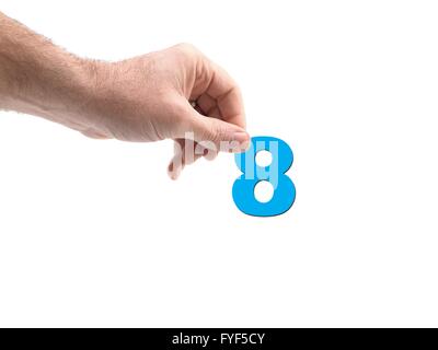 Numbers held by a hand isolated against a white background Stock Photo