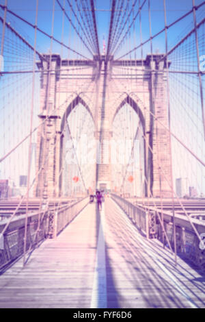 Vintage toned blurred vertical photo of the Brooklyn Bridge, NYC. Stock Photo