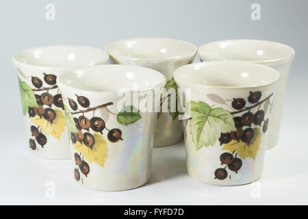 five painted porcelain shot glasses on a white background Stock Photo