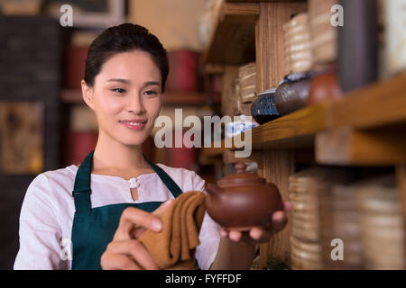 Tea house owner cleaning Stock Photo