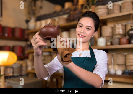 Tea house owner cleaning Stock Photo