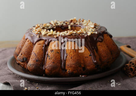 bundt cake with chocolate on plate Stock Photo