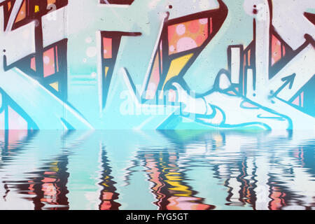 Abstract colorful graffiti reflection in the water Stock Photo