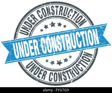 under construction blue round grunge vintage ribbon stamp Stock Vector