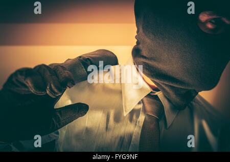 Bankster in a Mask. Felony Financial Worker Concept. Gangster Banker. Stock Photo