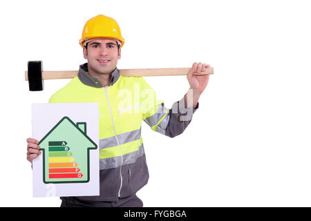 Construction worker with an energy rating card Stock Photo