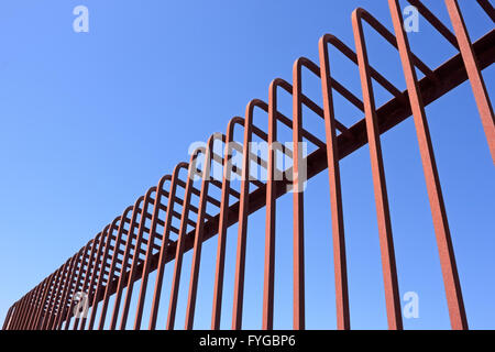 Fence with bent metal rods Stock Photo