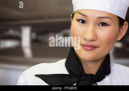 Composite image of closeup portrait of a smiling female cook Stock Photo