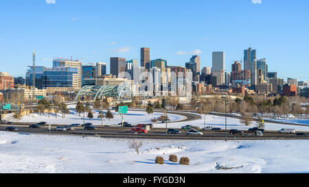 Denver, Colorado, USA - February  03, 2016: Winter view of Denver skyline and its busy streets and highway after a snow storm. Stock Photo