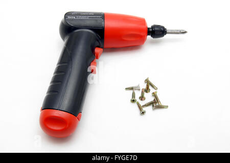 battery wireless screwdriver and set of screw on white Stock Photo