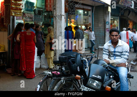 Young man on motorcycle, Old Delhi, India Stock Photo