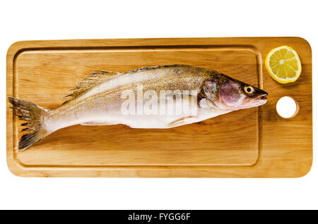 Pike perch on a wooden kitchen board, it is isolated on white Stock Photo