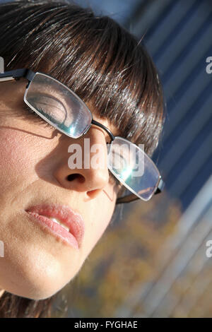 Business Woman enjoying the sunlight Stock Photo